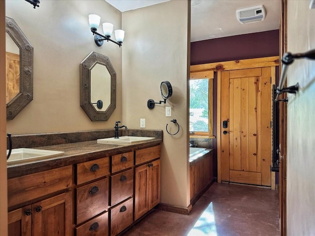 125 Tierra Del Dios, Rowe, NM 87562 - full bathroom with a sink, visible vents, a garden tub, and concrete flooring