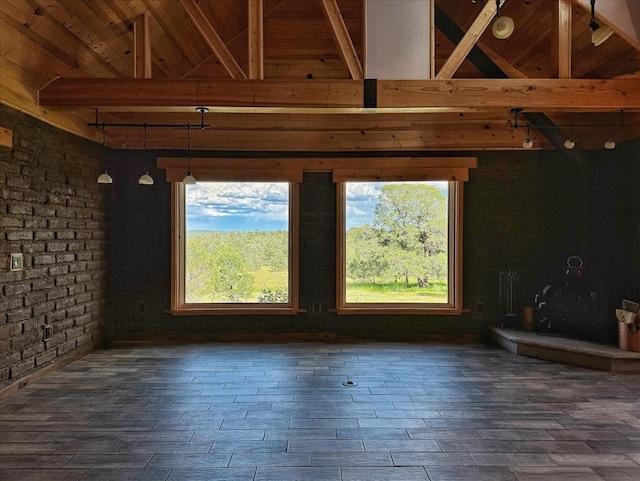 125 Tierra Del Dios, Rowe, NM 87562 - unfurnished living room with beamed ceiling, dark wood finished floors, and wooden ceiling