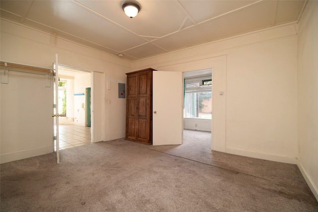 carpeted spare room featuring electric panel