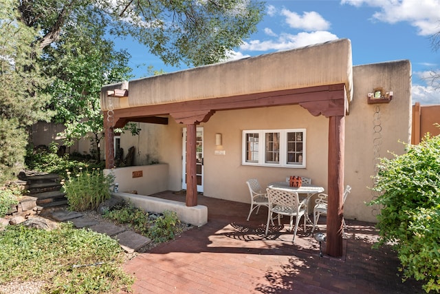 rear view of house with a patio