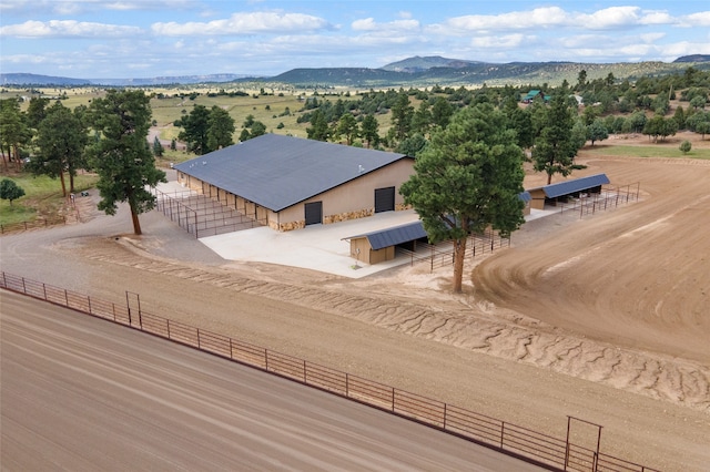 birds eye view of property featuring a rural view and a mountain view