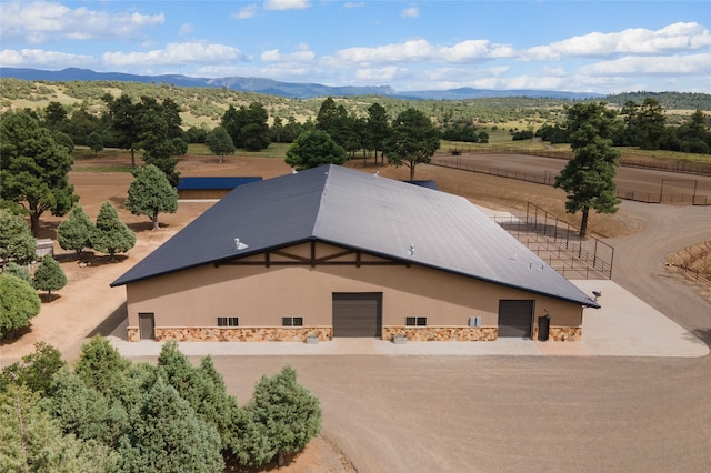 birds eye view of property featuring a mountain view