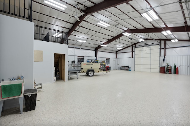 garage featuring metal wall and a sink