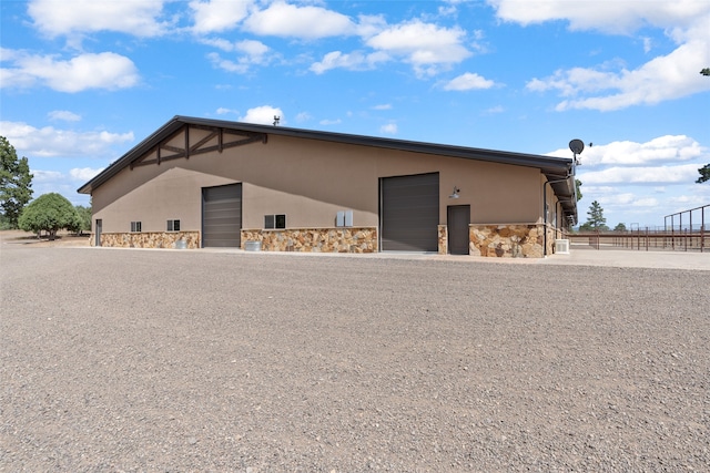 exterior space featuring an outbuilding and fence