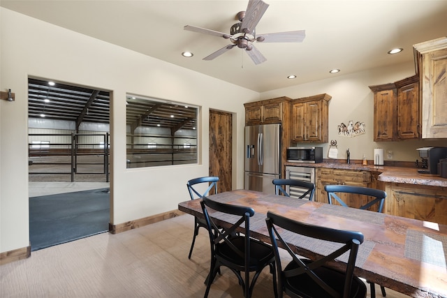 dining room featuring baseboards, a ceiling fan, and recessed lighting