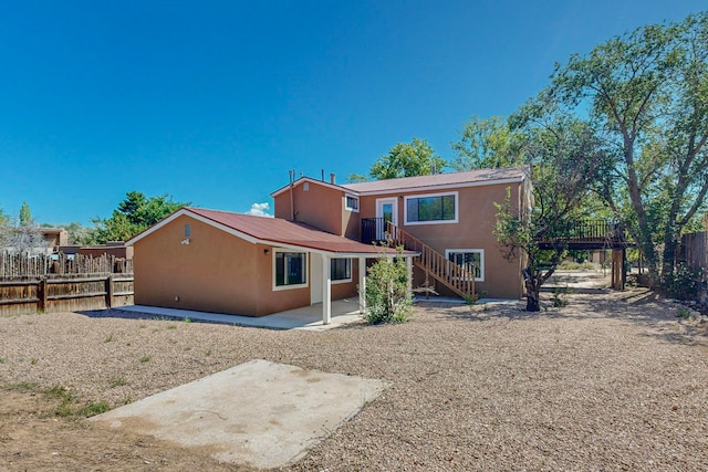 back of house featuring a patio