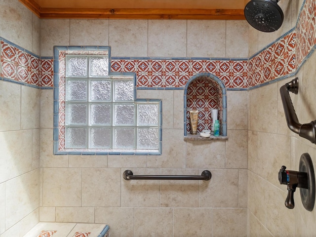 bathroom with a tile shower