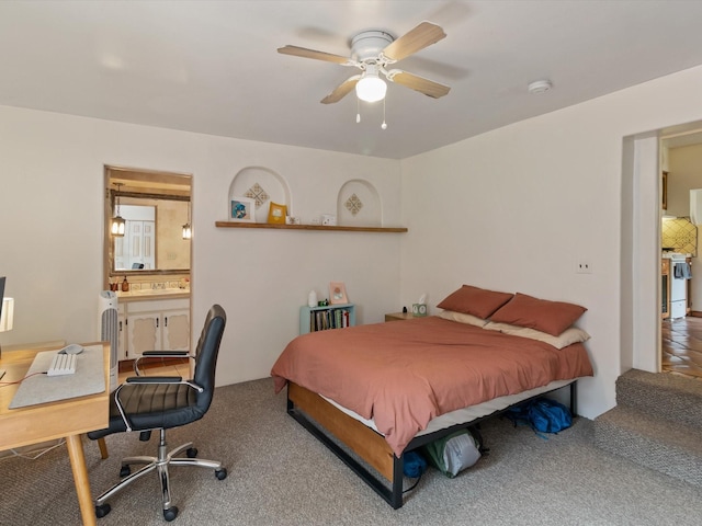 bedroom with carpet flooring, a ceiling fan, and ensuite bathroom