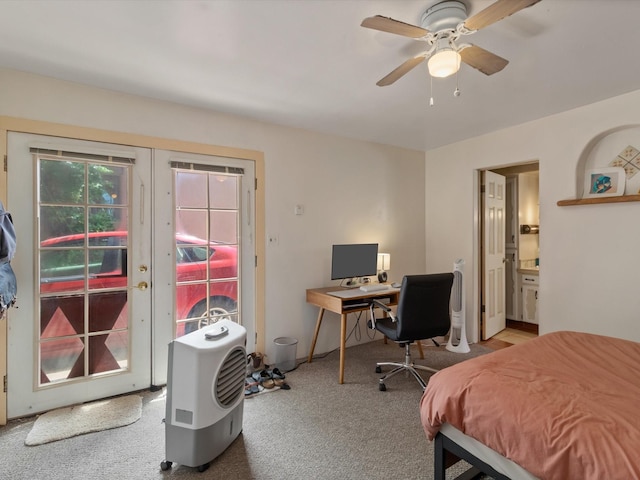 carpeted bedroom with connected bathroom, a ceiling fan, french doors, and access to outside