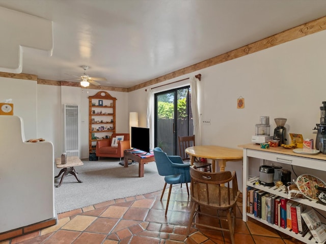 dining room featuring ceiling fan and carpet floors