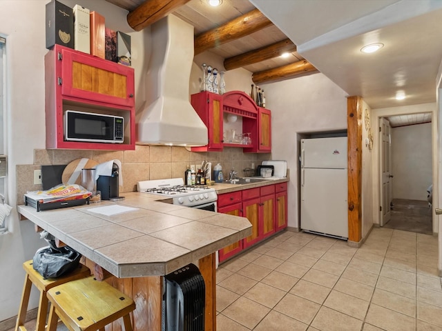 kitchen featuring white appliances, a peninsula, light tile patterned flooring, decorative backsplash, and island range hood