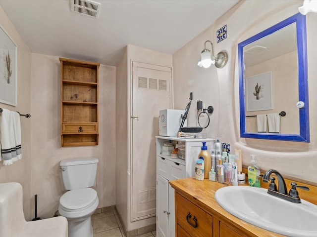 bathroom with vanity, tile patterned floors, toilet, and visible vents