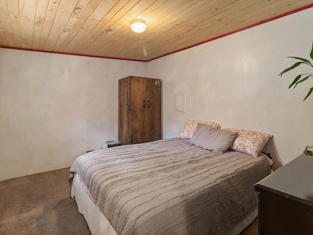 bedroom featuring carpet, wood ceiling, and crown molding