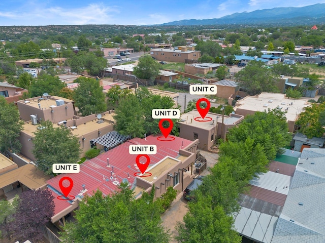 birds eye view of property with a mountain view