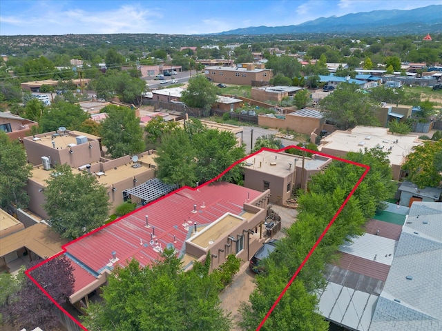 birds eye view of property with a mountain view