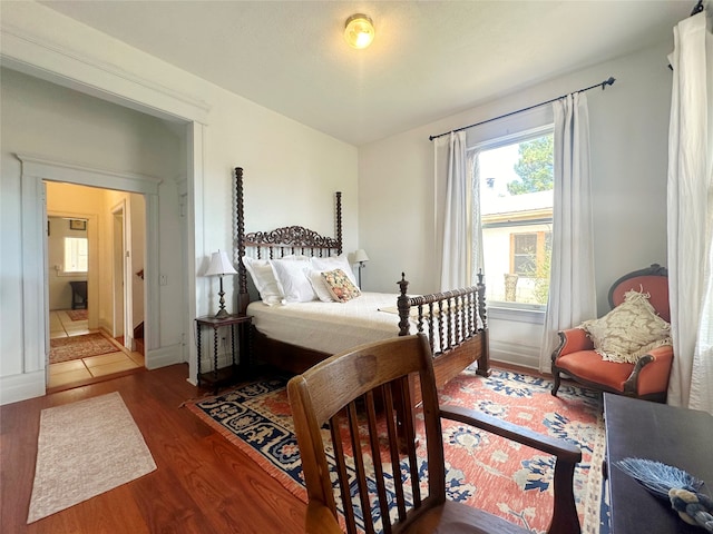 bedroom with wood-type flooring