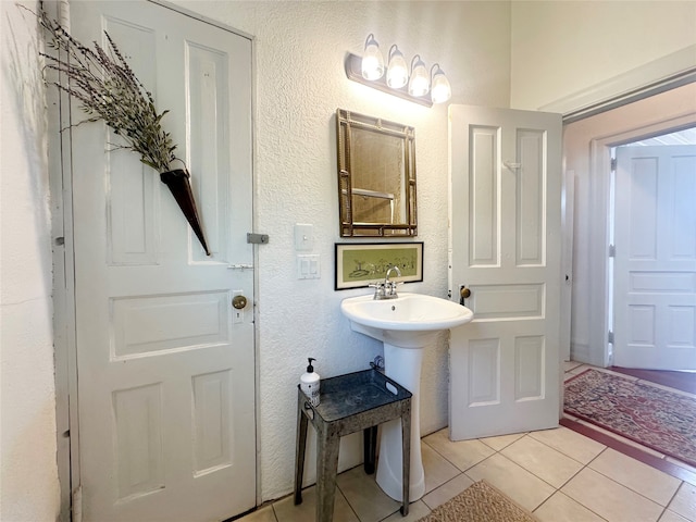 bathroom with tile patterned floors