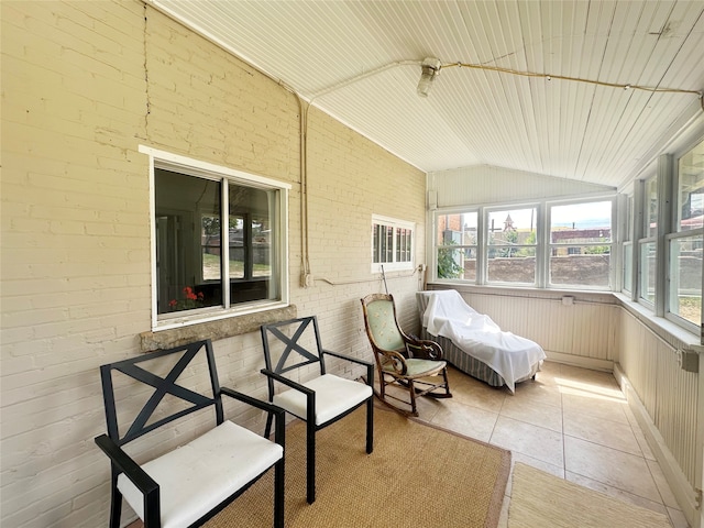 sunroom featuring wood ceiling and vaulted ceiling