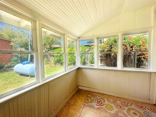 unfurnished sunroom featuring lofted ceiling and wood ceiling