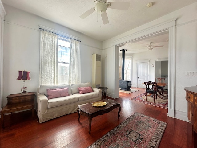 living room featuring ceiling fan and wood-type flooring