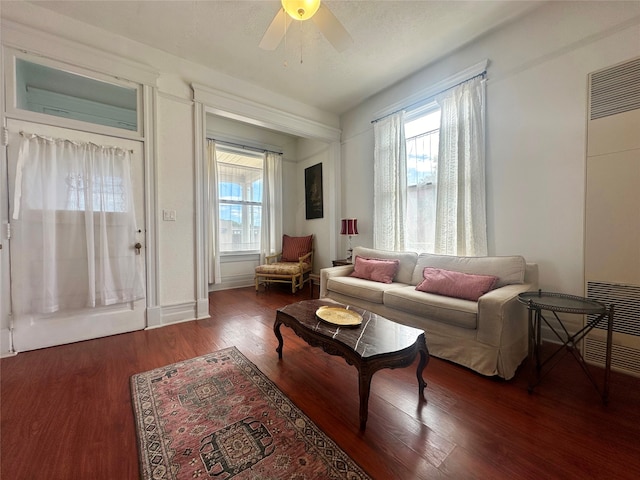 living room with hardwood / wood-style floors and ceiling fan