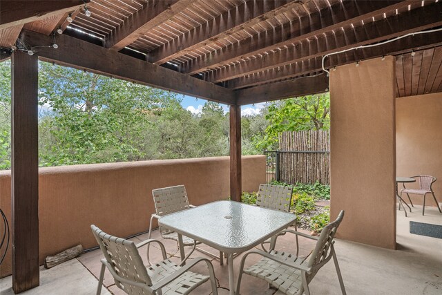 view of patio / terrace with fence, outdoor dining area, and a pergola