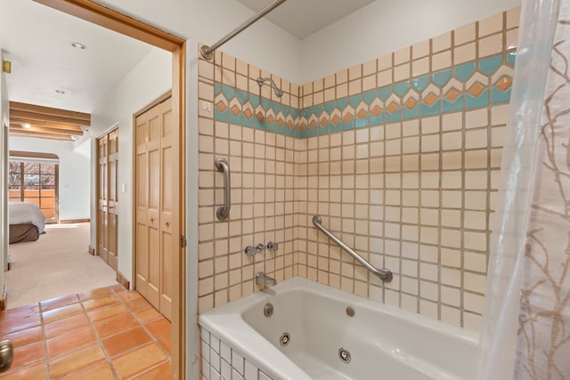 bathroom with tile patterned flooring and a combined bath / shower with jetted tub