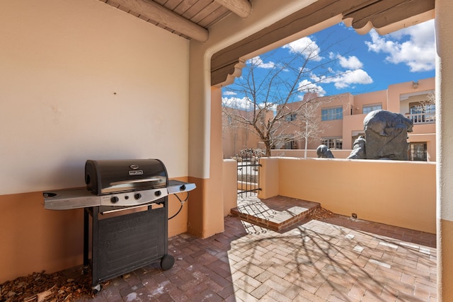 view of patio / terrace with a balcony and area for grilling