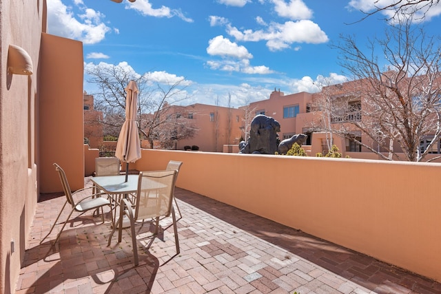 view of patio / terrace with outdoor dining area and a balcony