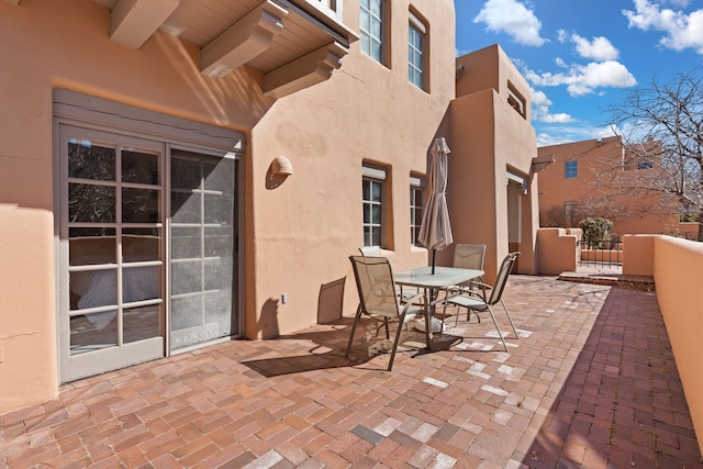 view of patio / terrace featuring outdoor dining area and fence