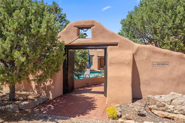 doorway to property featuring a patio area