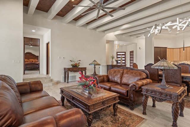 living room with beam ceiling and ceiling fan