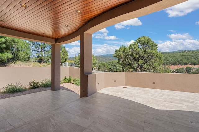 view of patio / terrace featuring a mountain view