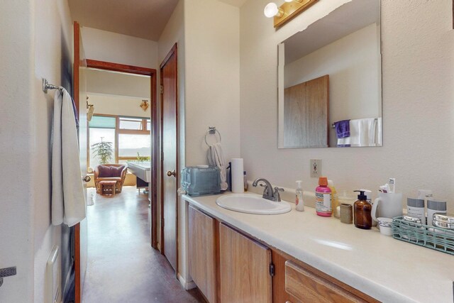 bathroom with vanity and concrete floors