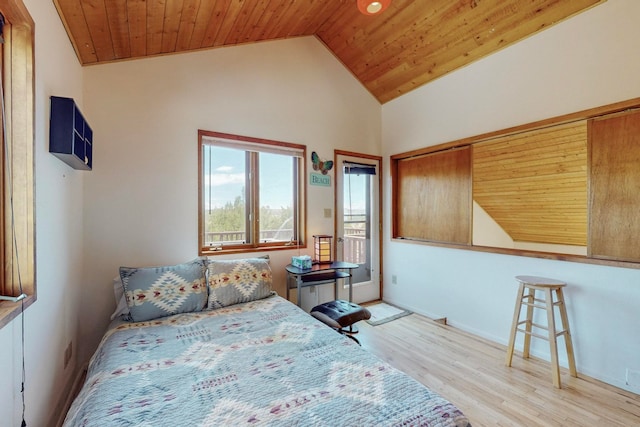 bedroom featuring vaulted ceiling, light wood-type flooring, and wooden ceiling