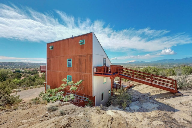 view of side of property with a mountain view