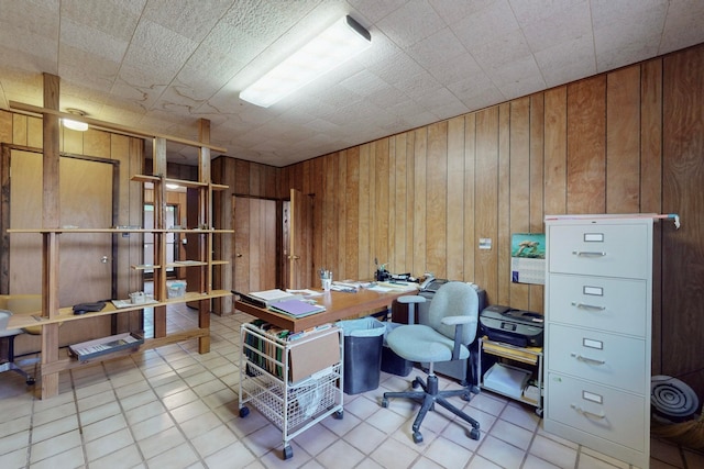 home office featuring wood walls and light tile patterned floors