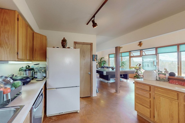 kitchen featuring white fridge, track lighting, and stainless steel dishwasher