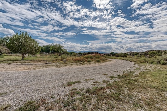 view of road featuring a rural view and a mountain view