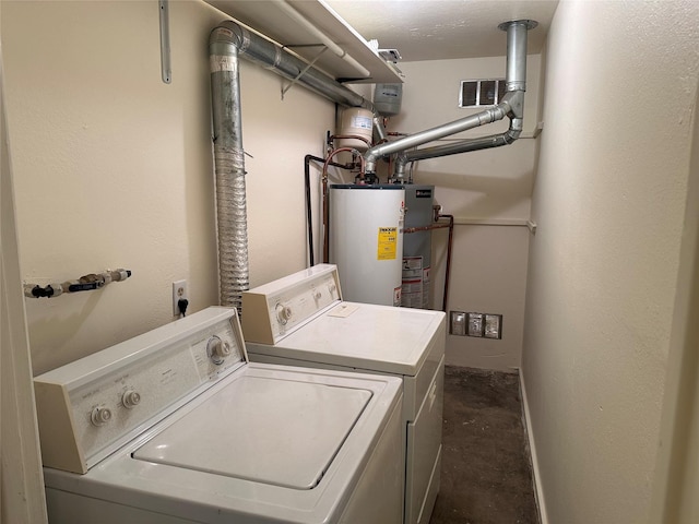 washroom featuring washer and clothes dryer, visible vents, water heater, laundry area, and baseboards