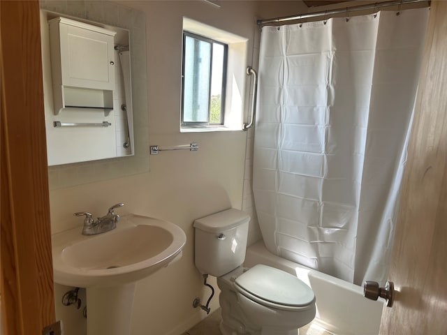 bathroom with toilet and shower / bathtub combination with curtain