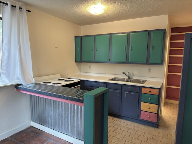 kitchen with a textured ceiling, light tile patterned floors, white electric range, a peninsula, and a sink