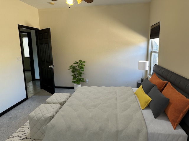 bedroom featuring ceiling fan and light colored carpet