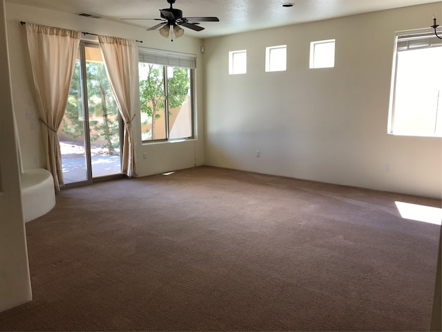 unfurnished room featuring carpet and ceiling fan