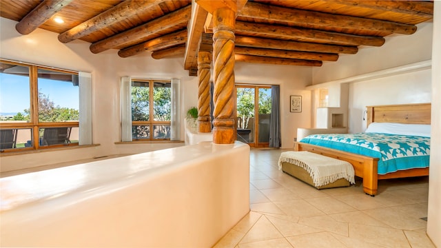 bedroom featuring light tile patterned floors, beam ceiling, and wooden ceiling