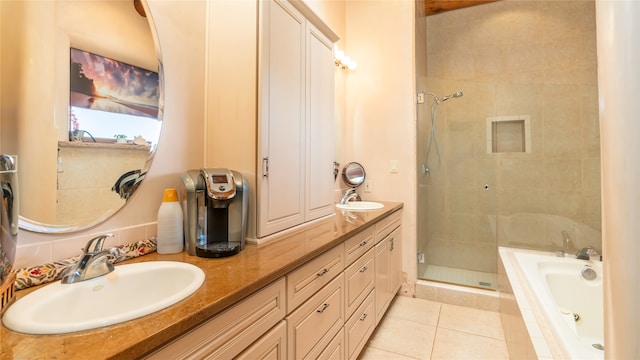 bathroom with tile patterned flooring, shower with separate bathtub, and vanity