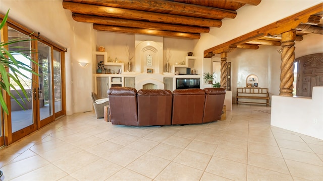 living room with beamed ceiling, french doors, and light tile patterned flooring