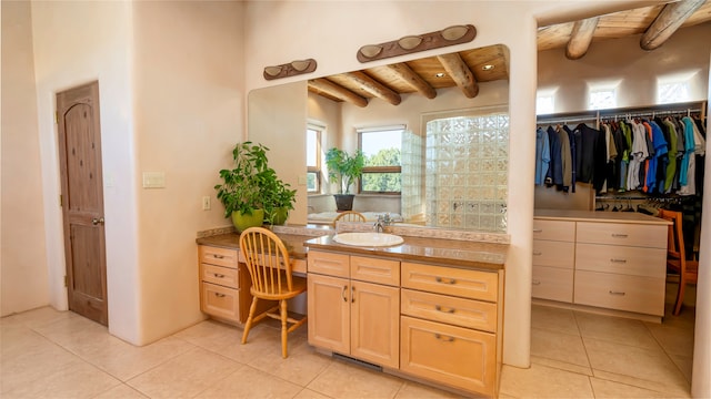 bathroom featuring tile patterned floors, wood ceiling, beam ceiling, and vanity