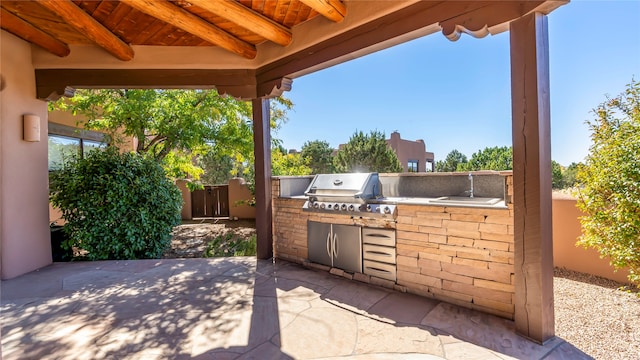 view of patio with exterior kitchen and grilling area