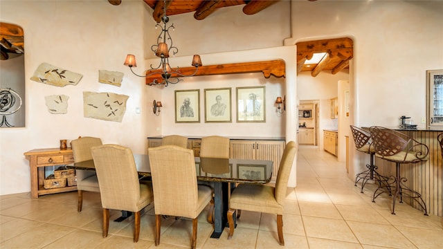 tiled dining area featuring high vaulted ceiling, wood ceiling, and beamed ceiling